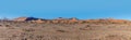 A panorama view of the early morning sun highlighting the east faces of dunes in Sossusvlei, Namibia Royalty Free Stock Photo