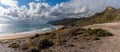 Panorama view of empty beaches and mountainous coast in Murcia under an expressive sky Royalty Free Stock Photo