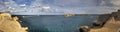 Panorama view of the entrance to the Valletta city harbor at Malta guarded by two lighthouses