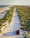 Panorama view, extreme couple travelers on car at country beach road among sea, sand, nature. Summer adventure, drone Royalty Free Stock Photo