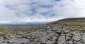 Panorama view of the glaciokarst coastal landscape of the Burren Coast in County Clare of western Ireland Royalty Free Stock Photo