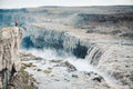Hiker at gigantic Dettifoss waterfall in Iceland Royalty Free Stock Photo