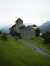 Panorama view of idyllic charming rural remote historic medieval hilltop castle Schloss Vaduz Liechtenstein alps Europe