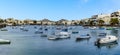 A panorama view of the idyllic scene of small boats moored in the lagoon of Charco de San Gines in Arrecife, Lanzarote Royalty Free Stock Photo