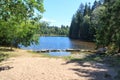 Panorama view of lake Karchesweiher surrounded by trees in Fichtel Mountains, Germany