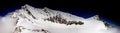 Panorama view of the view of the Lenzspitze peak and the Nadelhorn peak under a blue sky in the Alps of Switzerland Royalty Free Stock Photo