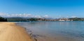 Panorama view of Maza Beach and San Vicente de la Barquera with Picos de Europa mountains in the background Royalty Free Stock Photo