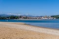 Panorama view of Maza Beach and San Vicente de la Barquera with Picos de Europa mountains in the background Royalty Free Stock Photo