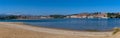 Panorama view of Maza Beach and San Vicente de la Barquera with Picos de Europa mountains in the background