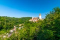 Panorama view of medieval castle Krivoklat, Czech Republic. Sunny day during summer, fresh forest near the castle