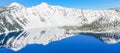 Panoramic scenic winter mirror reflection of snowcap mountain and Wizard Island on Crater Lake Royalty Free Stock Photo