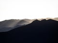 Panorama view of mountain range silhouette layers haze dust fog clouds at Misti volcano Arequipa Peru Andes