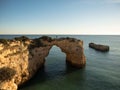 Panorama view of natural limestone arch bridge Arco de Albandeira beach atlantic ocean cove bay in Algarve Portugal