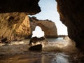 Panorama view of natural limestone arch bridge Arco de Albandeira beach atlantic ocean cove bay in Algarve Portugal