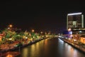 Panorama View of night near river of Melaka river with wheel and bridge.