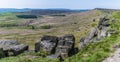 A panorama view over millstone boulders on the cliff top at the Stanage Edge escarpment in the Peak District, UK Royalty Free Stock Photo