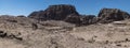 A panorama view past a donkey towards the Great Temple and western cliffs in the ancient city of Petra, Jordan Royalty Free Stock Photo