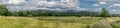 A panorama view of Pendle Hill and gathering rain clouds.