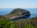 Panorama view of Punta Anciola lighthouse on seaside green hill Cabrera National Park Mallorca Balearic Islands Spain Royalty Free Stock Photo