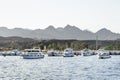 Panorama view of Red sea harbor with many white private yacht. Tourist ships parked at port near mountains. Egypt Sharm El Sheikh Royalty Free Stock Photo