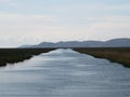 Panorama view of river channel canal at Uros Floating reed Islands on blue Lake Titicaca Puno Peru andes South America Royalty Free Stock Photo