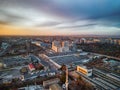 Panorama view of the road with a circular motion and a flower bed at sunset. Aerial photography.