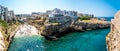 Panorama view of the rocky peninsula and the entrance to the coastal inlet at Polignano a Mare, Puglia, Italy