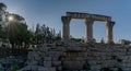 Panorama view of the ruins of Ancient Corinth in southern Greece with a sunburst