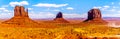 Panorama view of the sandstone formations of East and West Mitten Buttes and Merrick Butte in Monument Valley Royalty Free Stock Photo