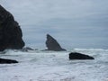 Panorama view of sea stack rock formation cliff at Praia de Adraga rough atlantic ocean coast wind storm Lisbon Portugal