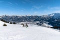 Panorama view snow covered Austrian Alps mountain range in winter sunny day clear blue sky above Reutte Hahnenkamm ski resort Royalty Free Stock Photo