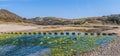 A panorama view of stepping stones on the beach at Three Cliffs Bay, Gower Peninsula, Swansea, South Wales Royalty Free Stock Photo