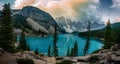 Panorama View Sunrise with turquoise waters of the Moraine lake with sin lit rocky mountains in Banff National Park of Royalty Free Stock Photo