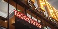Panorama view Tex Mex restaurant welcome sign with LED Tacos to go text in Texas, America