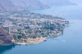 Panorama view to the village Panajachel at the lake Atitlan with amazing volcanos - Guatemala