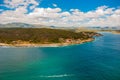 Panorama view from the top, turquoise and blue the color of water. A small fishing island of Cayo Granma can be seen in the Strait