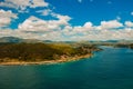 Panorama view from the top, turquoise and blue the color of water. A small fishing island of Cayo Granma can be seen in the Strait