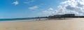 Panorama view of tourists enjoying a beautiful day on the beaches at Saint-Malo in Normandy during the long summer holdiays