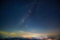 Panorama view universe space shot of milky way galaxy with stars on night sky background at mountains and city light landscape Royalty Free Stock Photo