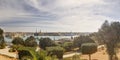 Panorama view of the Valletta city harbor area at Malta, with many historic buildings along the coastline and a red ship Royalty Free Stock Photo