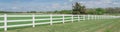 Panoramic long wooden white fence to horizontal line in cloud blue sky at farmland in Ennis, Texas, USA Royalty Free Stock Photo