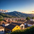 a panorama of a village with a blue sky and the Andes Mountains in the backgroun...