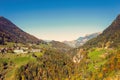 Panorama of the village of VÃÂ¤ttis and bridge against the background of the Swiss Alps at sunset. St. Gallen, Switzerland. Royalty Free Stock Photo