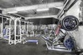 Panorama of a vintage bright gym. White sport equipment and blue seats