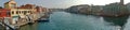 Panorama with water boats canal and traditional buildings in Murano, Italy