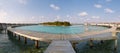 Panorama of water bungalows in hotel on Maldives. Villas on Indian ocean at luxury spa resort. Royalty Free Stock Photo