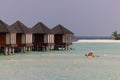 Panorama of Water Villas Bungalows and wooden jetty at Tropical beach in the Maldives at summer day Royalty Free Stock Photo