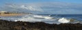 Panorama of waves splashing on basalt rocks at Ocean Beach Bunbury Western Australia