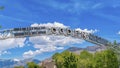 Panorama Welcome arch at the city of Ogden Utah against vivid blue sky and puffy clouds Royalty Free Stock Photo