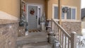 Panorama Wet stairs at home entrance leading to front door with christmas tree and wreath Royalty Free Stock Photo